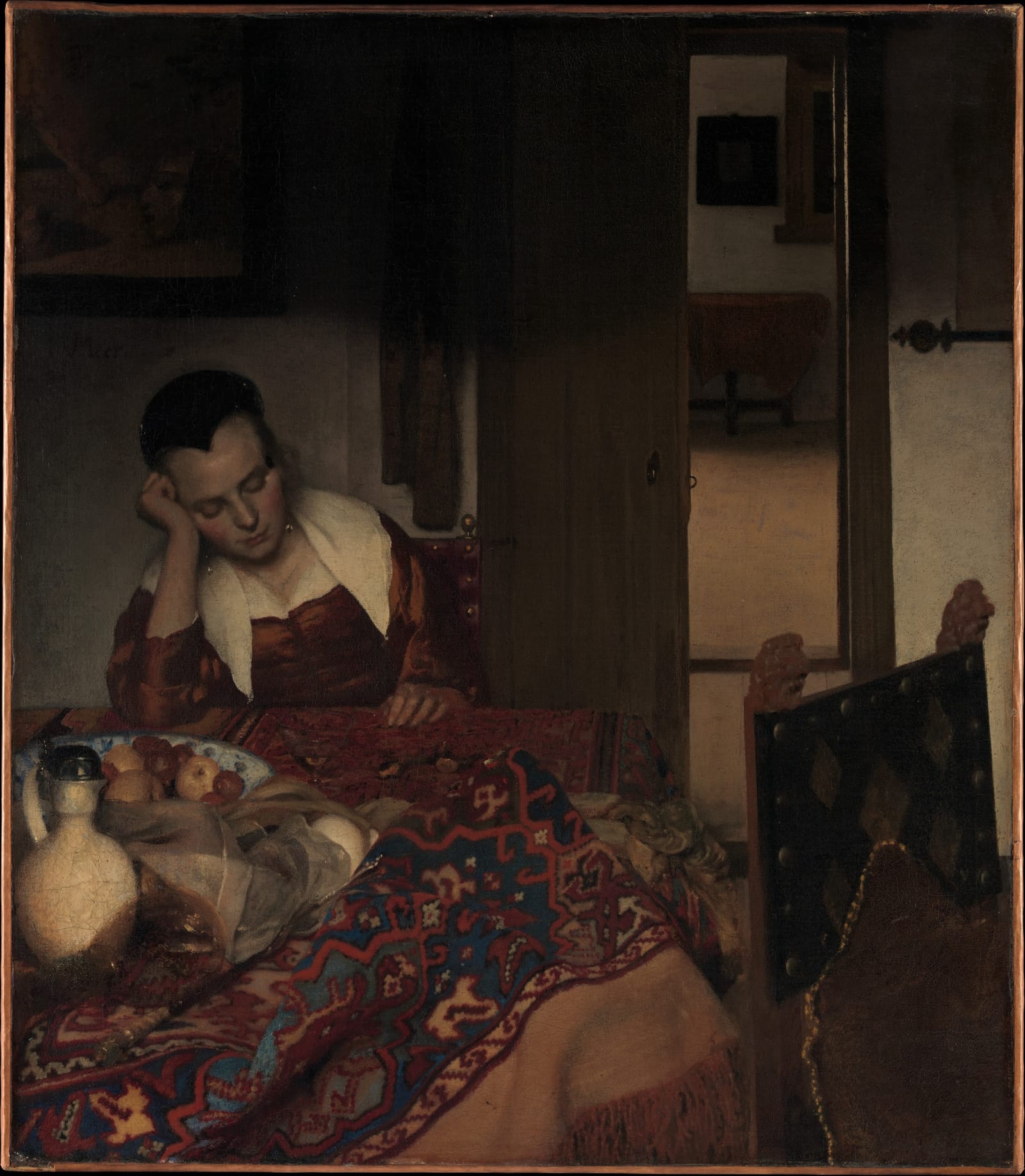 A young woman dozes at a table with her head on her hand; a door opens to a bright room behind her.